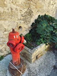 High angle view of fire hydrant against wall