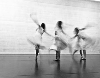 Blurred motion of women dancing