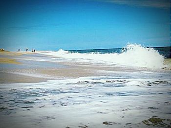 Scenic view of beach against clear sky