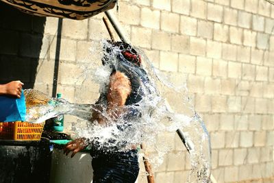 Man splashing water