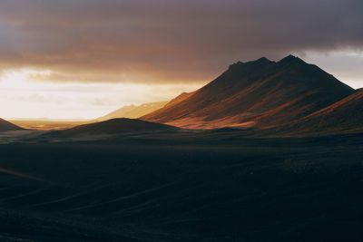 View of mountain range against cloudy sky