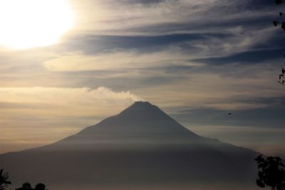Scenic view of volcano against sky during sunset