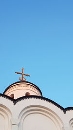 Low angle view of traditional building against clear blue sky