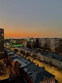 High angle view of illuminated buildings against sky during sunset