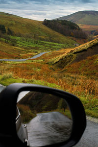 Scenic view of landscape seen through car windshield