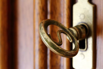 Close-up of key in door