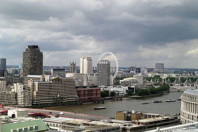 City skyline against cloudy sky