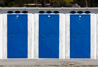 Closed blue door of building