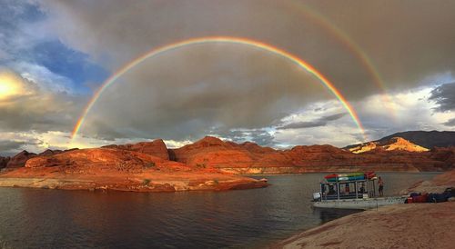 Rainbow over mountain against sky