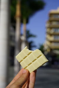 Close-up of hand holding ice cream cone