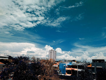 Modern buildings in city against sky