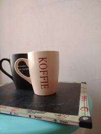 Close-up of coffee cup on table