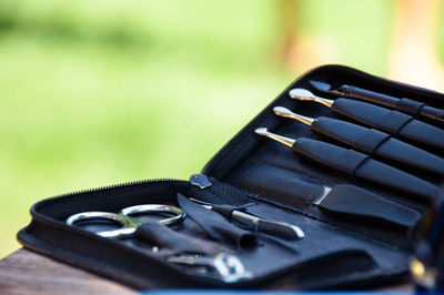 Close-up of tool kit on table