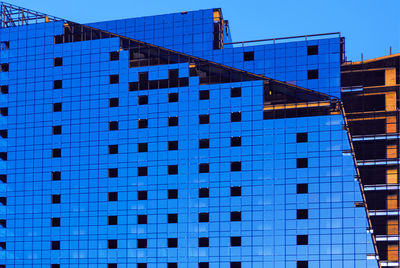 Blue architecture with modern windows . sky reflection in the building