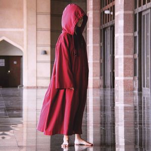 Midsection of woman with red umbrella