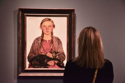 Portrait of woman sitting at home