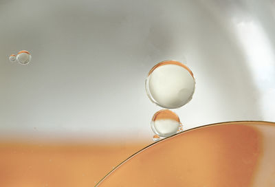 Close-up of bubbles in mid-air over water