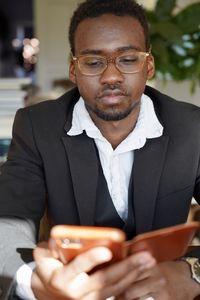 Portrait of man using mobile phone