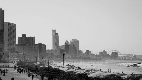 Panoramic view of buildings in city against clear sky