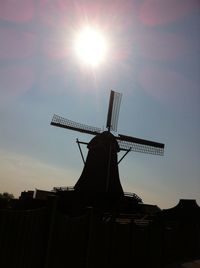 Traditional windmill against sky