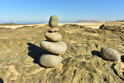 Balanced art form zen rock stack found on beach in baja, mexico