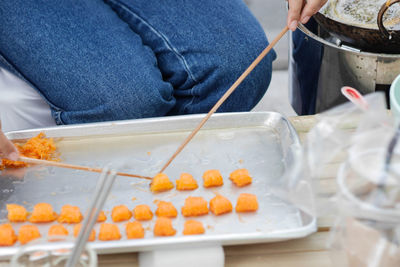 Midsection of man preparing food