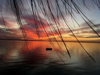 Scenic view of sea against orange sky