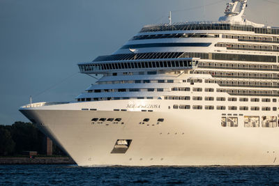 Ship sailing on sea against sky