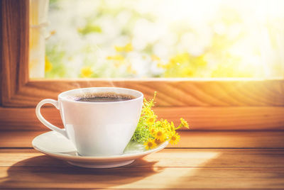 Close-up of coffee cup on table