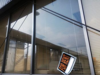 Low angle view of office building against sky