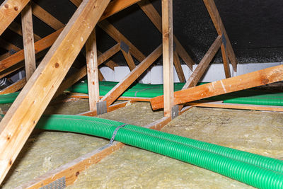 High angle view of water pipe on wood