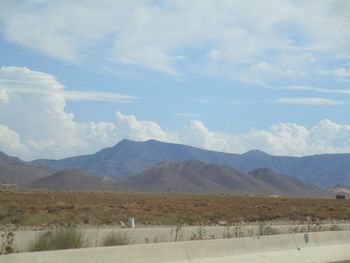 Scenic view of landscape and mountains against sky