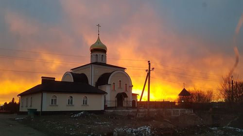 Building against sky during sunset