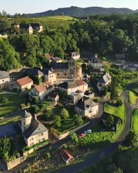 High angle view of townscape against trees and houses