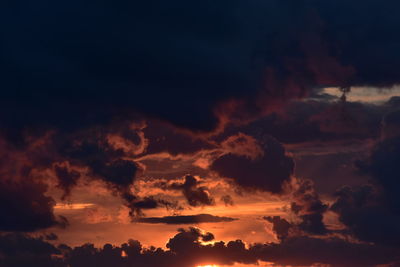 Low angle view of dramatic sky during sunset