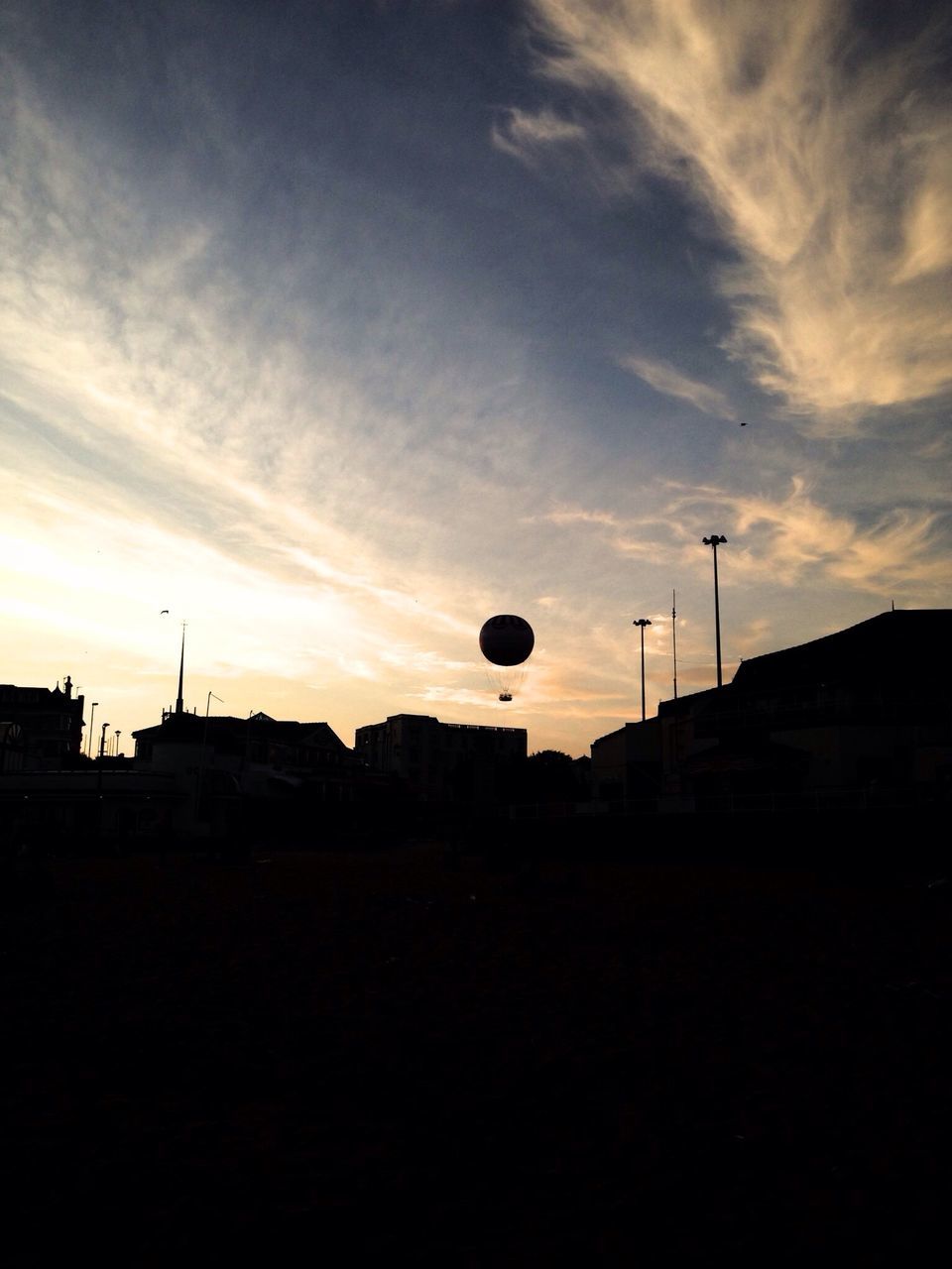 silhouette, sunset, sky, built structure, architecture, building exterior, street light, low angle view, cloud - sky, orange color, outdoors, cloud, copy space, dark, dusk, no people, nature, lighting equipment, tranquility, house