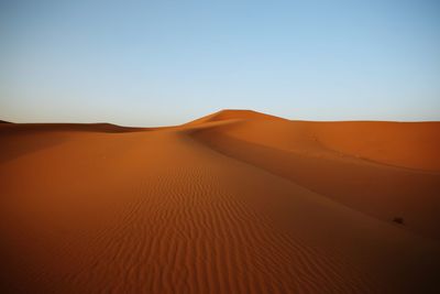 Scenic view of desert against clear sky