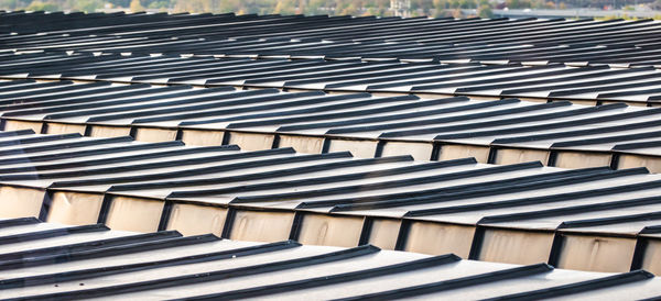 Detail view of a roof of a high-rise building with aluminium profiles as roof covering