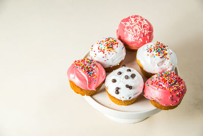 Close-up of ice cream on table against white background