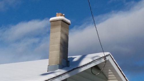 Low angle view of built structure against blue sky