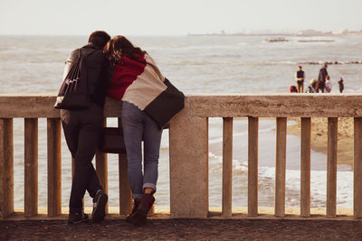 Rear view of couple on beach