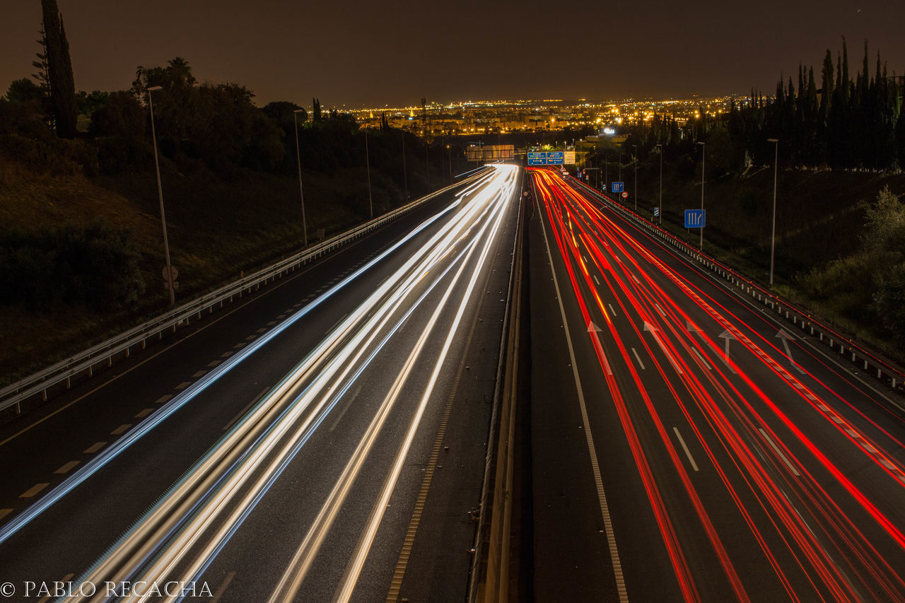 light trail, long exposure, speed, night, illuminated, transportation, motion, road, street, traffic, outdoors, high street, no people, city, sky, architecture