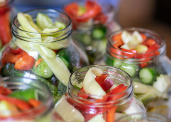 Close-up of fruits in glass jar on table