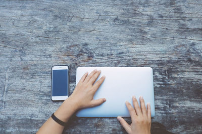Midsection of person using mobile phone