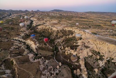 High angle view of man on rocks against sky