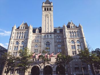 Low angle view of clock tower against sky