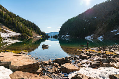 Hiker enjoys the sunrise views from lake agnes in lake louise