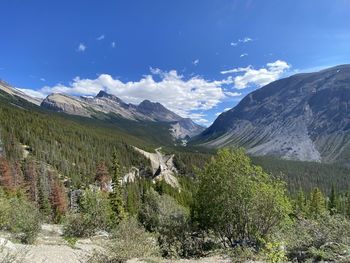 Scenic view of landscape and mountains against sky