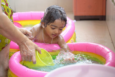 Girl playing in swimming pool