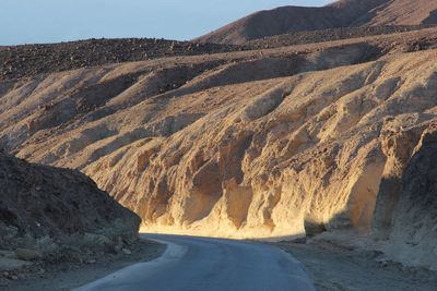 Scenic view of mountain road against sky